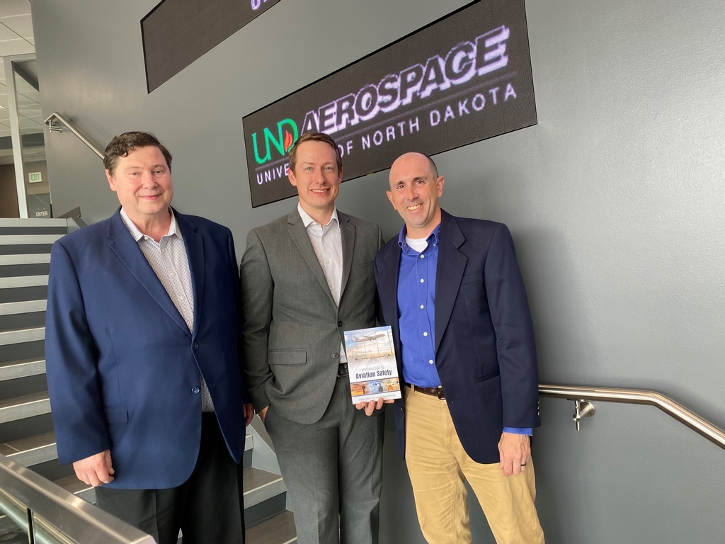 UNDAerospace's tweet photo. Congratulations to Gary Ullrich, Ryan Guthridge, and Brandon Wild on the publication of their new book.  “Introduction to Aviation Safety,” is published by Kendall Hunt and will be utilized in AVIT 208. 

https://t.co/fOIuAmD6Zr

#UNDproud #AerospaceAccomplishments #flyUND https://t.co/CJbCj9VOZB