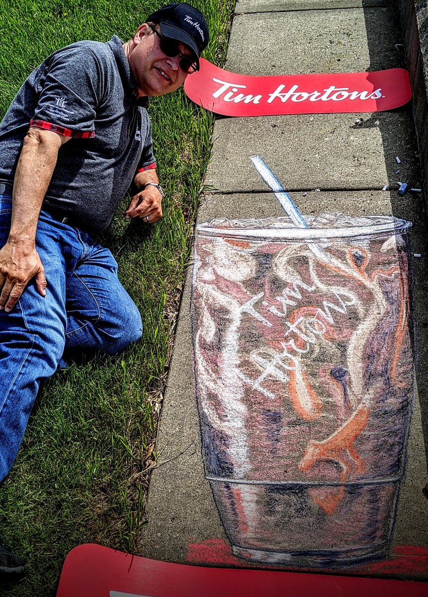 LKeindel's tweet photo. How is this for supporting our local #DevonAlberta @TimHortons? Mike has found the #KeindelSize to be the perfect amount of #ColdBrew on a hot day! #sidewalkchalkart #TimHortons #DevonAlbertaChamberofCommerce #DevonDispatch #streetart #chalkart https://t.co/C2CCZ5M4VX
