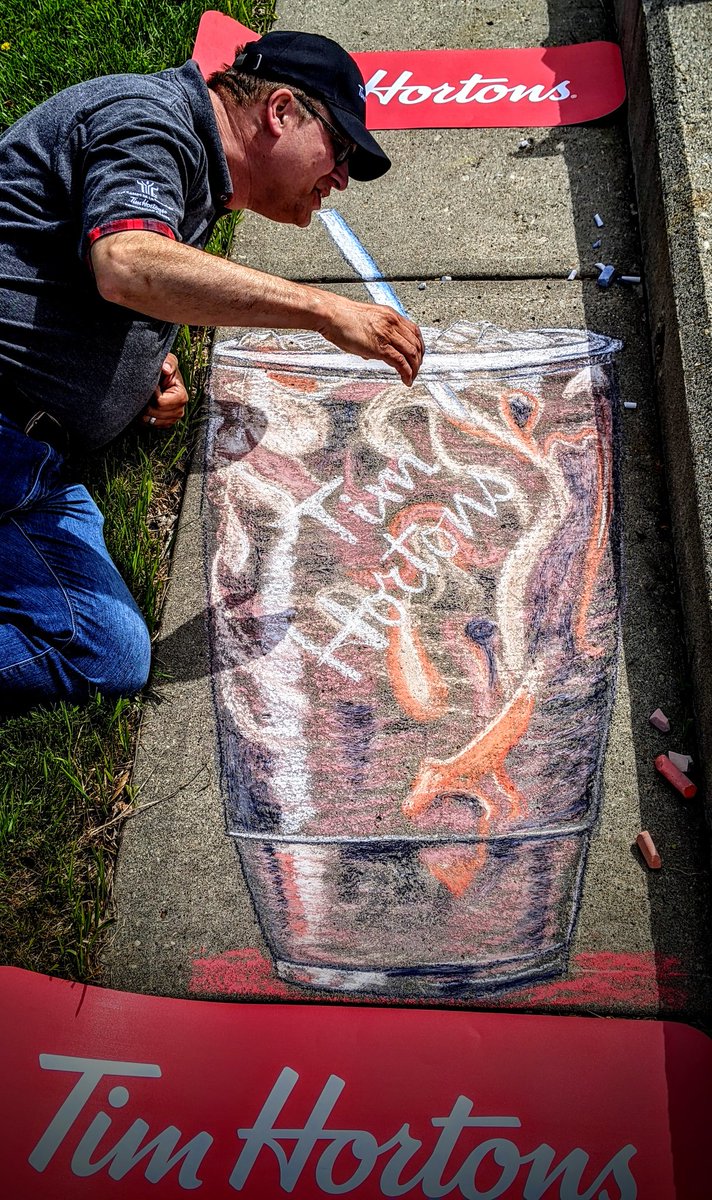 LKeindel's tweet photo. How is this for supporting our local #DevonAlberta @TimHortons? Mike has found the #KeindelSize to be the perfect amount of #ColdBrew on a hot day! #sidewalkchalkart #TimHortons #DevonAlbertaChamberofCommerce #DevonDispatch #streetart #chalkart https://t.co/C2CCZ5M4VX