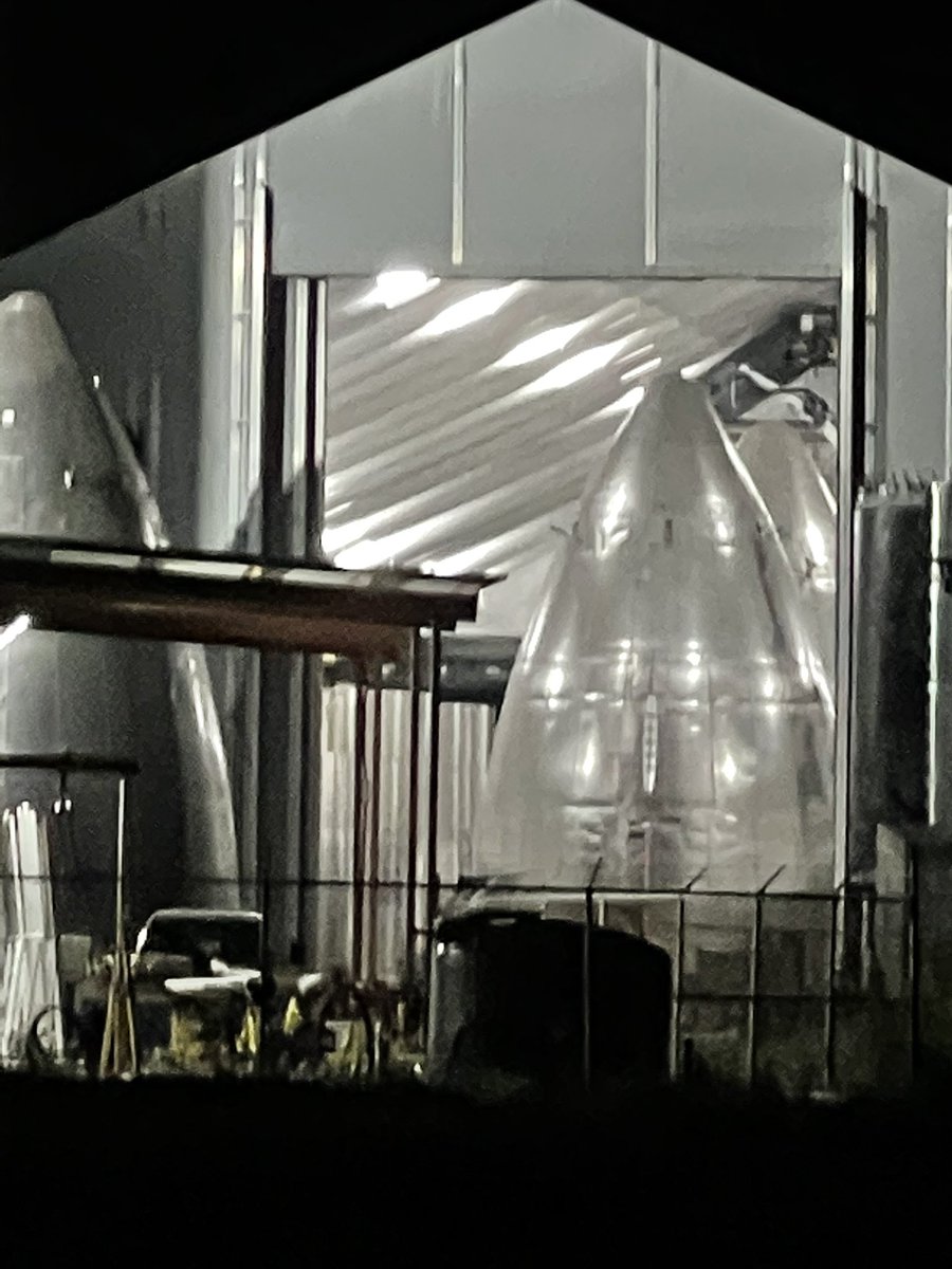 BocachicaMaria1's tweet photo. Cell shots. Nosecone tent at night is awesome to see. If visiting, plan an evening visit and stay till after sunset. #VAB empty. View down #RocketRd. #MidBay full. @DESpaceX @StarshipBoca @Michael10711597 @JohnRand0061 
5.22.21 BCM https://t.co/SPgli5ZUpw
