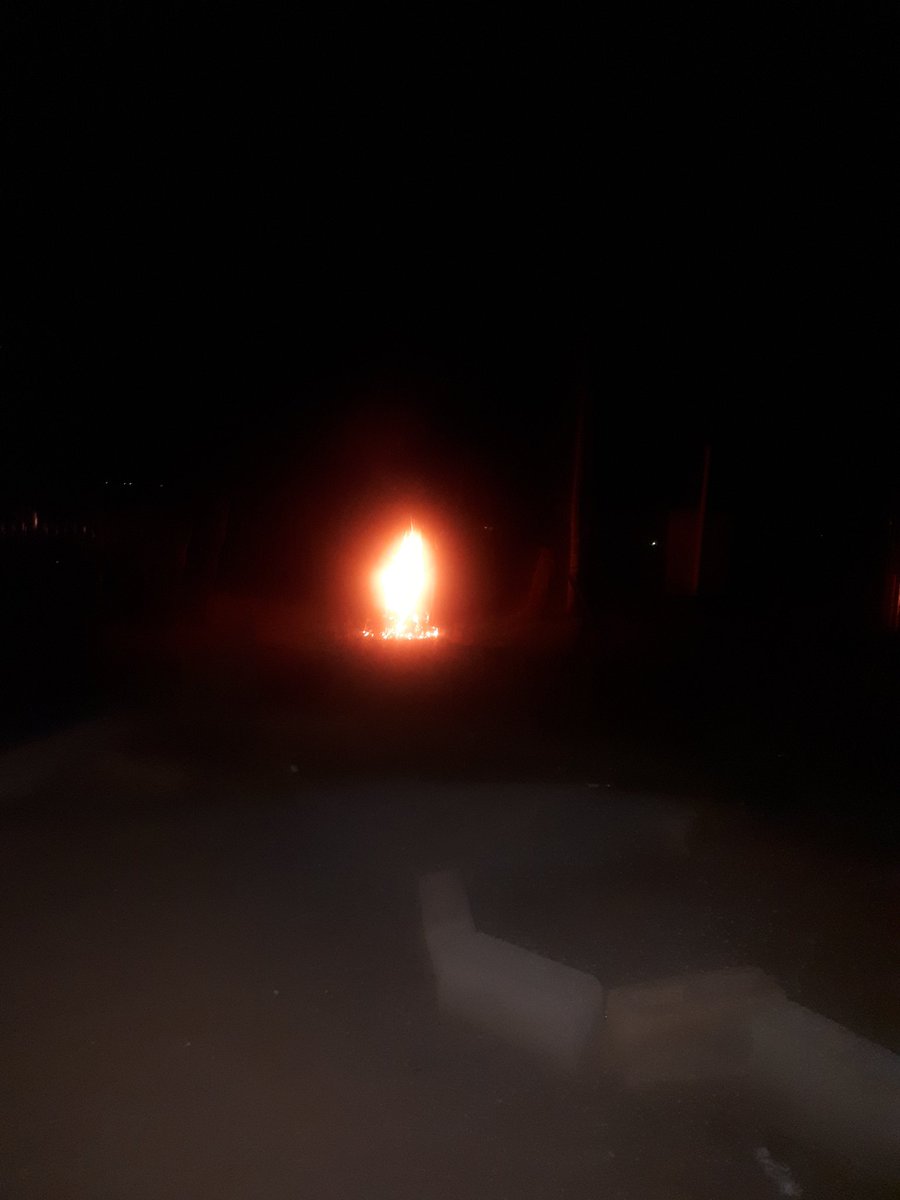 ChabeliRegg's tweet image. View from my window as factory workers have touched tyres in the village road