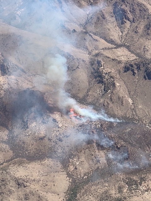 CoronadoNF's tweet image. Warren Fire in high remote location, Chiricahuas. 160A in grass and brush. Air tanker and helicopter assigned. 2 crews following retardant, 2 crews ordered. Retardant effective.