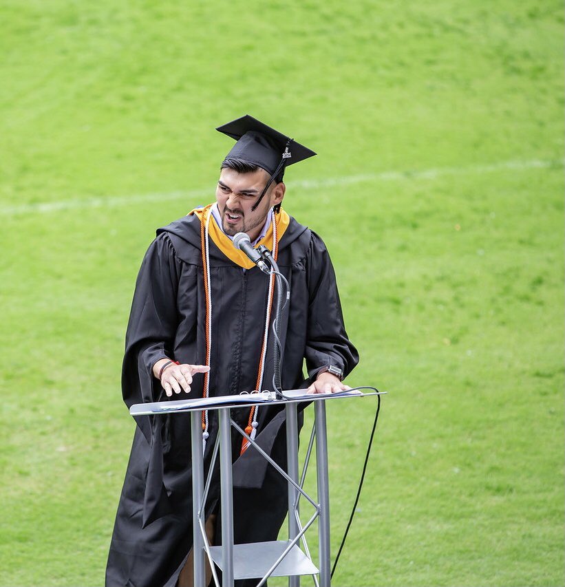 LetMeBeYourGUYd's tweet photo. I was lucky enough to be the commencement speaker for the graduate students at my school. Tell me why I look like I’m firing Triple H in the picture they took of me. https://t.co/zGvigx6Bp0