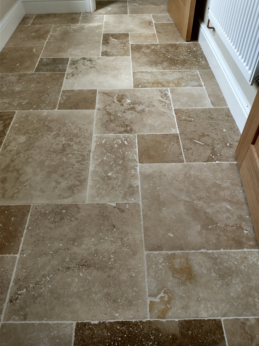 Utility and toilet floor in travertine completed using <a href="/tilemasteradhes/">Tilemaster Adhesives</a>  fracture mat, setaflex and jasmine grout3000. Sealed with <a href="/Universeal_UK/">Universeal Sealants</a> rapid all in one sealer.
