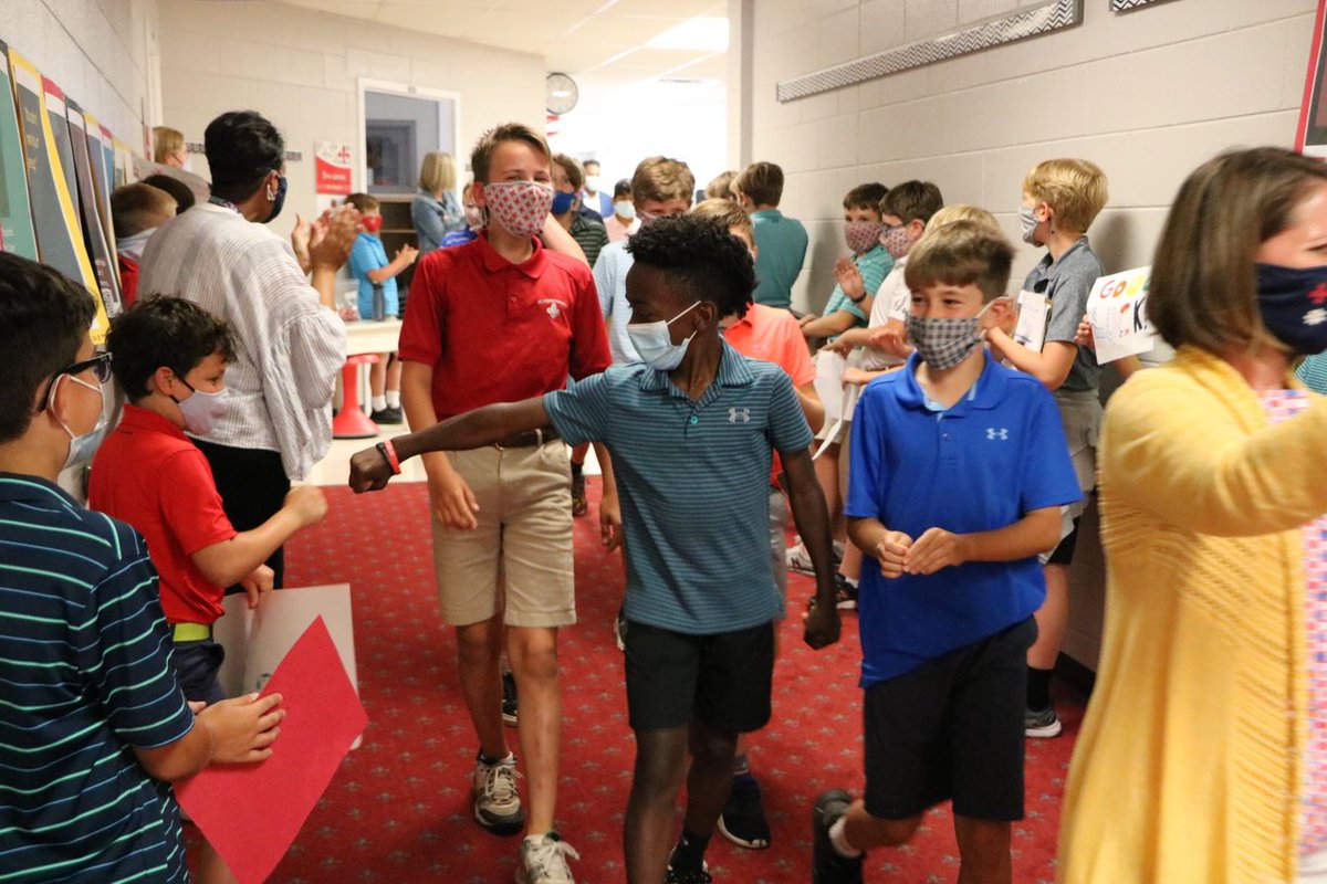 STCVA's tweet photo. Yesterday afternoon, fifth grade boys participated in a symbolic walk of class unity through the LS hallways while the third and fourth grade cheered them on. Students made their way across St. Christopher's Road to reflect on years past and prepare for the years ahead. https://t.co/YMcwIGMPAW
