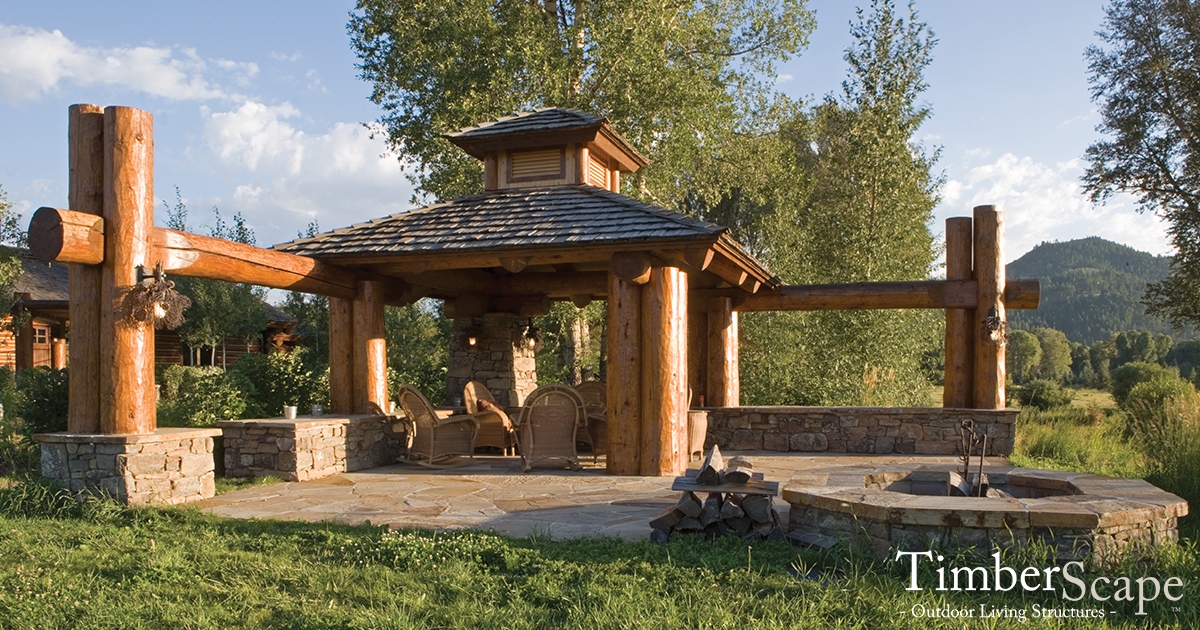 TimberScape's tweet photo. This custom log #gazebo uses handcrafted cluster posts to create this a space perfect for watching the sunset either under the beams or around the fire pit. Learn about our custom designs at https://t.co/dUK5CpHSUi.
#customgazebo⁠
#outdoorspace⁠
#loggazebo⁠
#uniquegazebos https://t.co/t8kL0X6xtS