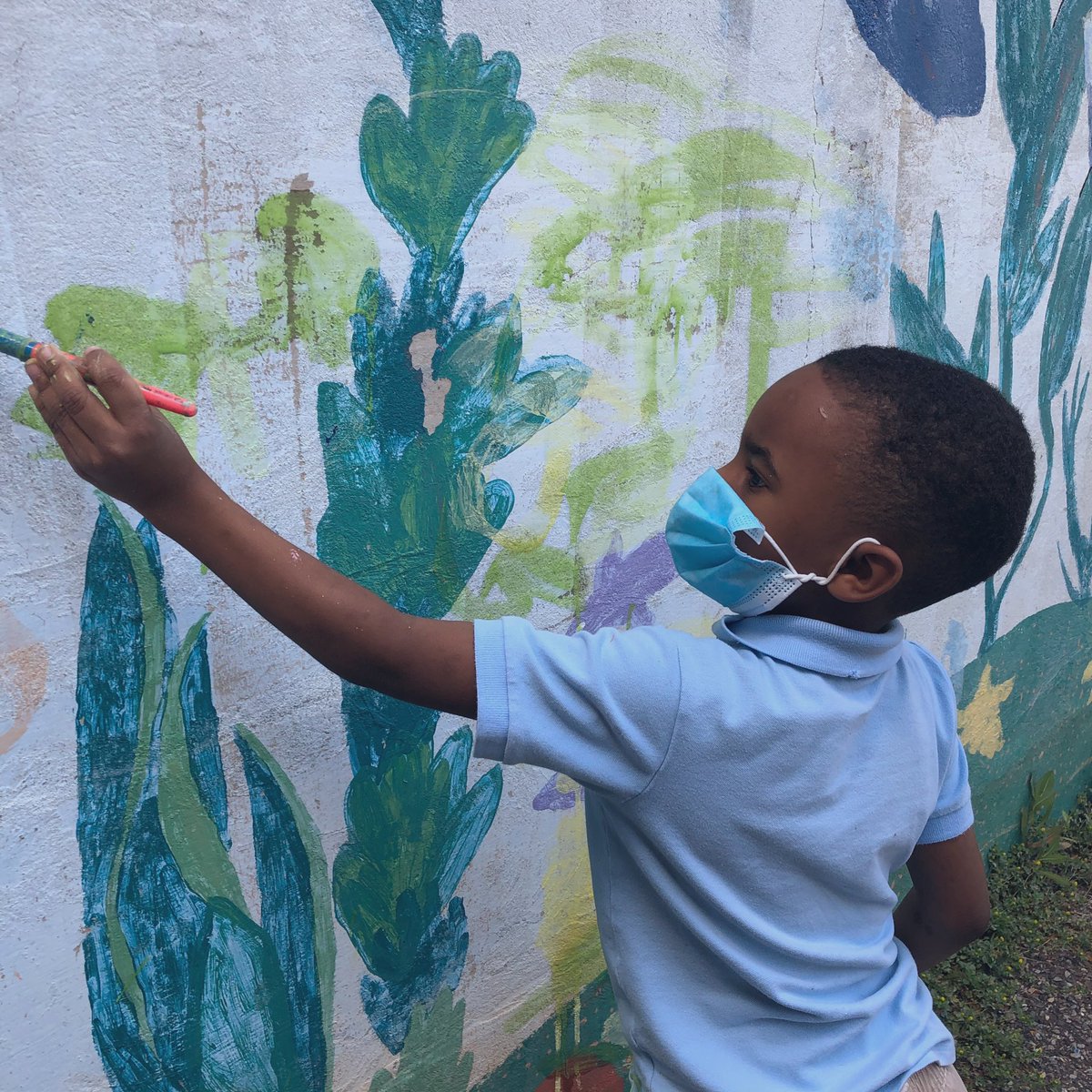 A young artist creating a masterpiece 🎨👨🏾‍🎨