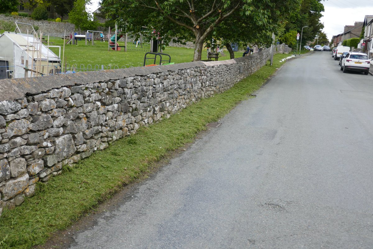 TheLengthsman's tweet photo. For once this week it wasn't #raining so put a hard shift in at #Allithwaite strimming the village verges ~ love the kids hanging over the park wall "wot's your name mister" and I get nice #waves from the Mothers ! https://t.co/C5LdNInvMG