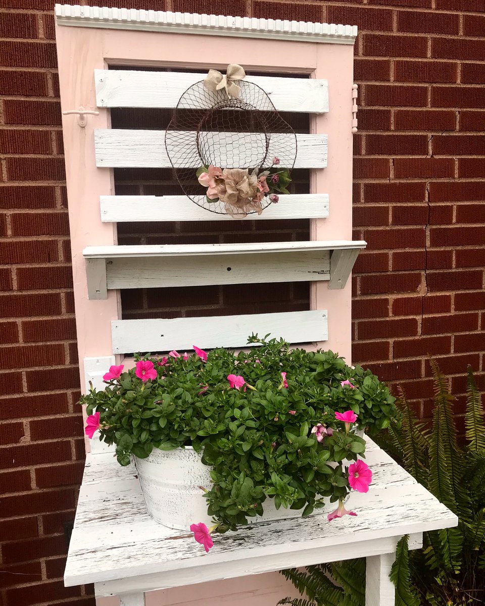 Loving the look of this old door turned #plant stand in my #garden. I painted it pink &amp; white this year along with some other old furniture in my garden. I also painted the container my petunia #flowers are in as well to match. #gardening #gardendecor #gardendesign #Horticulture
