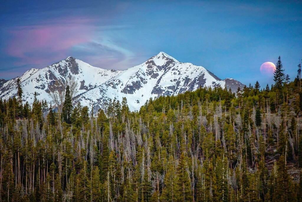 Caught some lunar eclipse before it dipped behind the mountains.