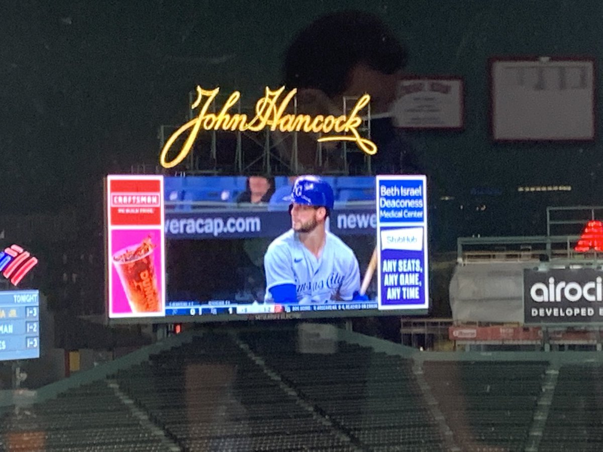 SmittyOnMLB's tweet photo. Andrew Benintendi playing baseball on the Jumbotron at Fenway Park during the rain relay .... and he just homered https://t.co/qhG4UtGu9x