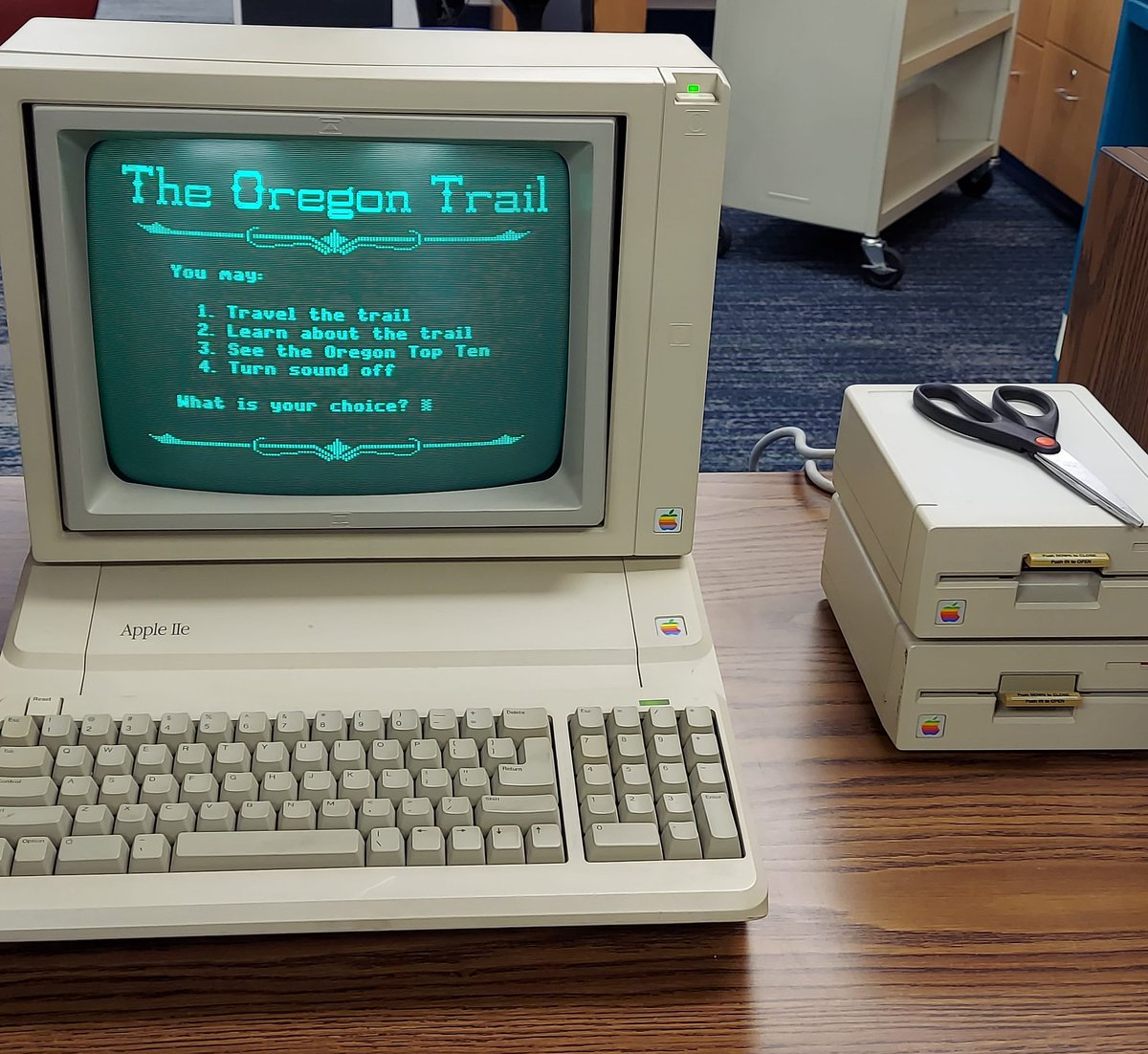Why yes, that IS an Apple IIe running Oregon Trail via the original floppy disk.

And here you thought the library couldn't get any cooler...