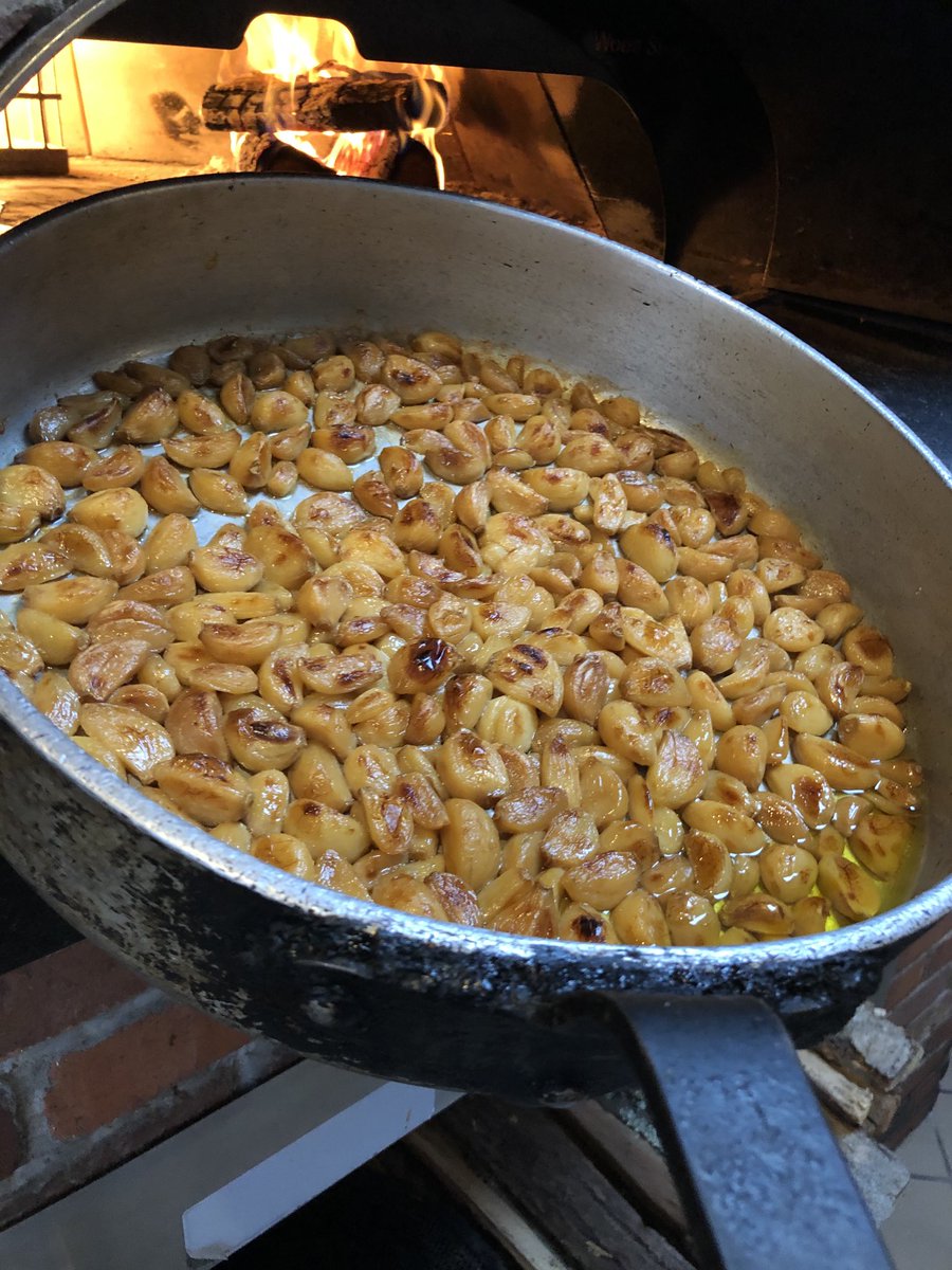 And the prep work begins. Wood oven roasted garlic, green pepper, onion and mushrooms for some of your delicious vegetable pizza toppings.