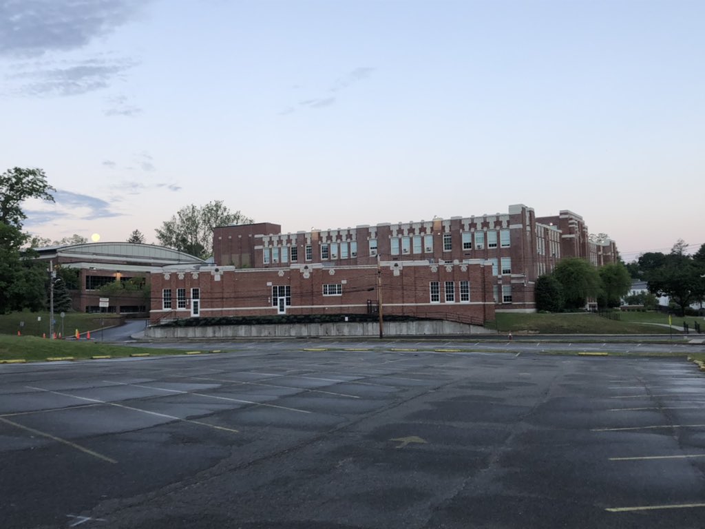 The morning moon looks like a giant softball stuck on the roof of the high school gym. <a href="/KTrentowski/">Oyster Bay Athletics 2012-2021</a>