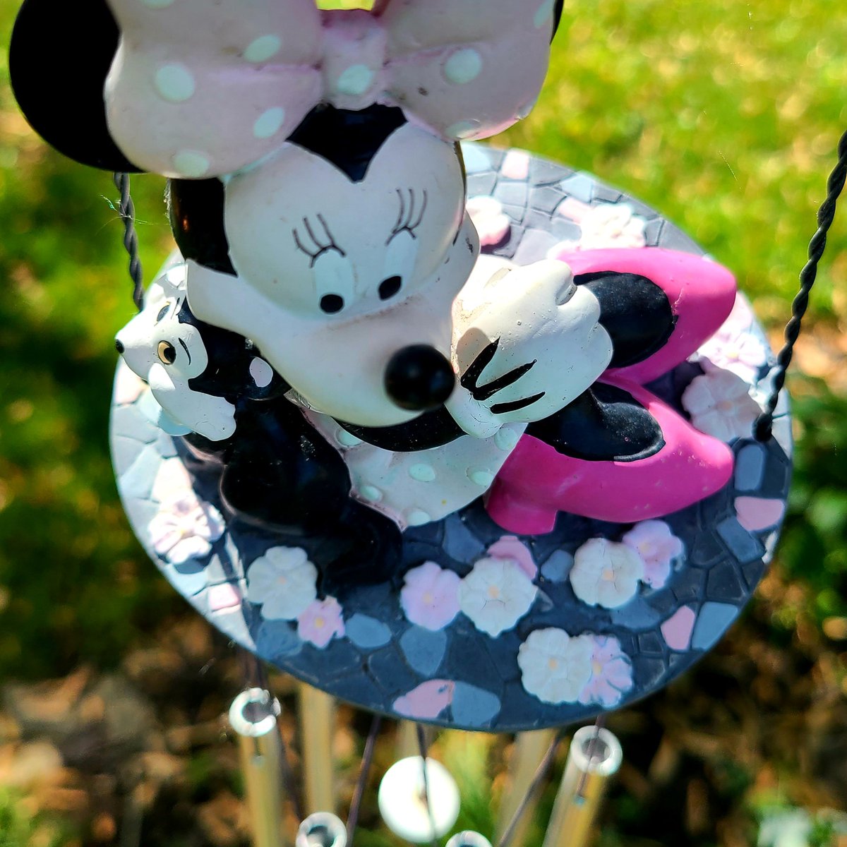 SueOestmann's tweet photo. LAST DAY to share for Week 21 #TheColorPink Minnie's bright pink shoes hanging in my garden. #Windchimes #OutpostLadiesPhotoChallenge https://t.co/krnzuyTylo