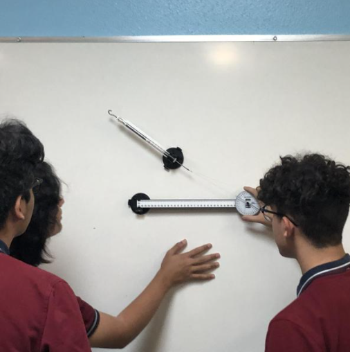 AlexTorresAPLIT's tweet photo. @MrsAvilaIII1 Throwback to the day in physics class that will forever live in infamy. Nothing bad happened. It's just a picture of Ben, Eddie, and me measuring something that somehow got on the school website. #TBT https://t.co/ED02L2Wx9t