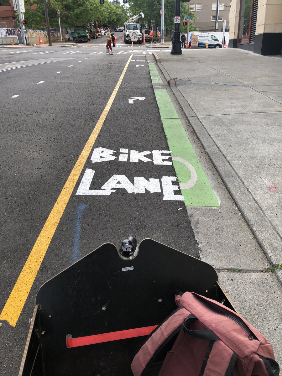 seabikeblog's tweet photo. The worker who taped out this temporary bike lane marking on Main St near 5th Ave is a true artist. I love this font. #SEAbikes https://t.co/N9ES0SY8Lr