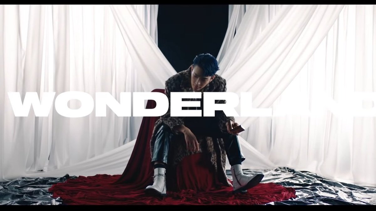 there are also some references to the Wonderland MV! in my opinion Wonderland MV explains the rest of the story after they get rid of fedora/masked men and crown look at their outfits for the performance and those white/red fabrics in the first image!