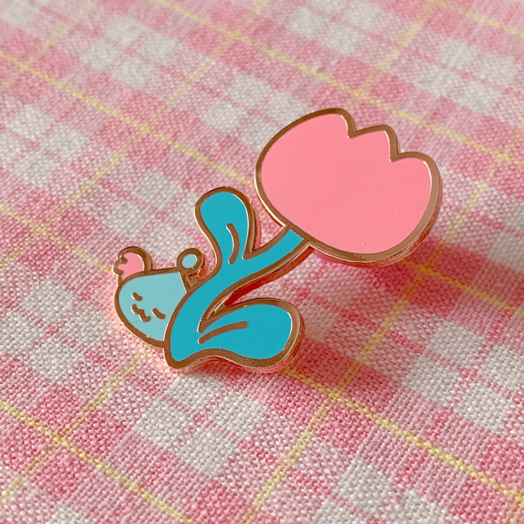 An enamel pin from creative brand Mogumu