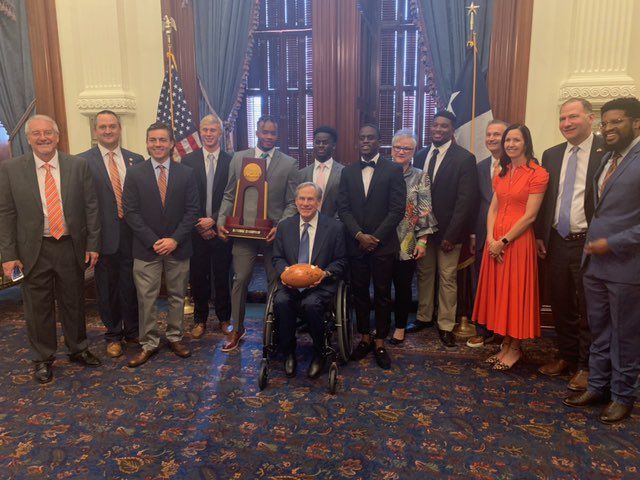 Group photo including Sam Houston football team, governor Abbott and Dr White at the Texas senate.