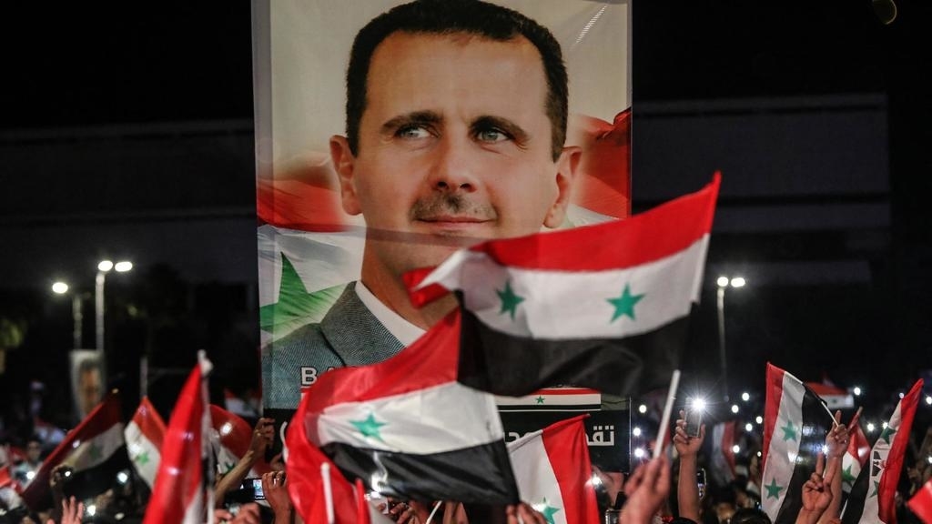 احتفالات في دمشق بعد إعلان فوز بشار الأسد بولاية رئاسية رابعة. الغد الاردن