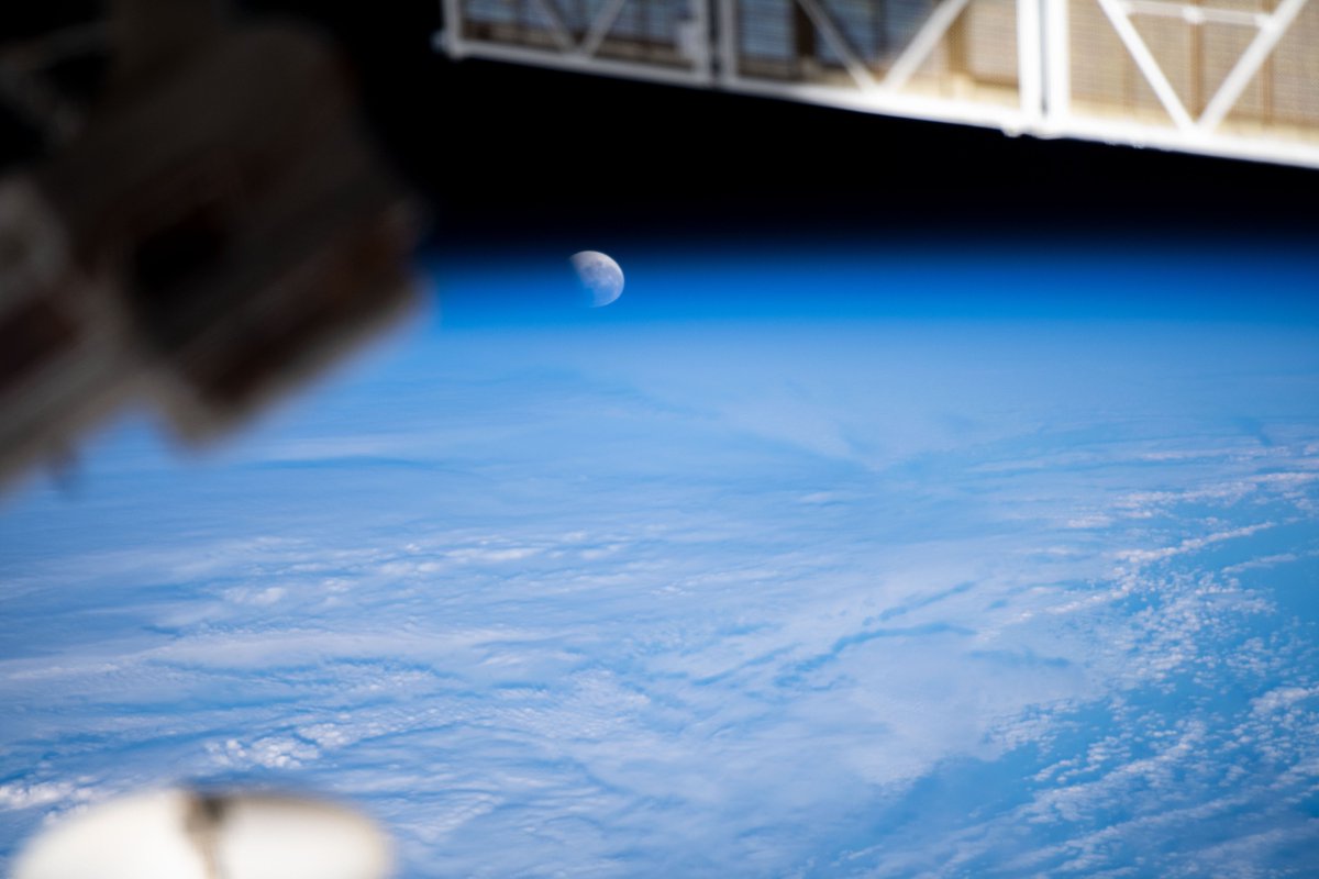 iss065e074523 (May 26, 2021) --- The Moon pictured during a lunar eclipse, and intersecting with the Earth's horizon, is seen from the International Space Station during a northwest to southeast orbital trek 263 miles above the Pacific Ocean.