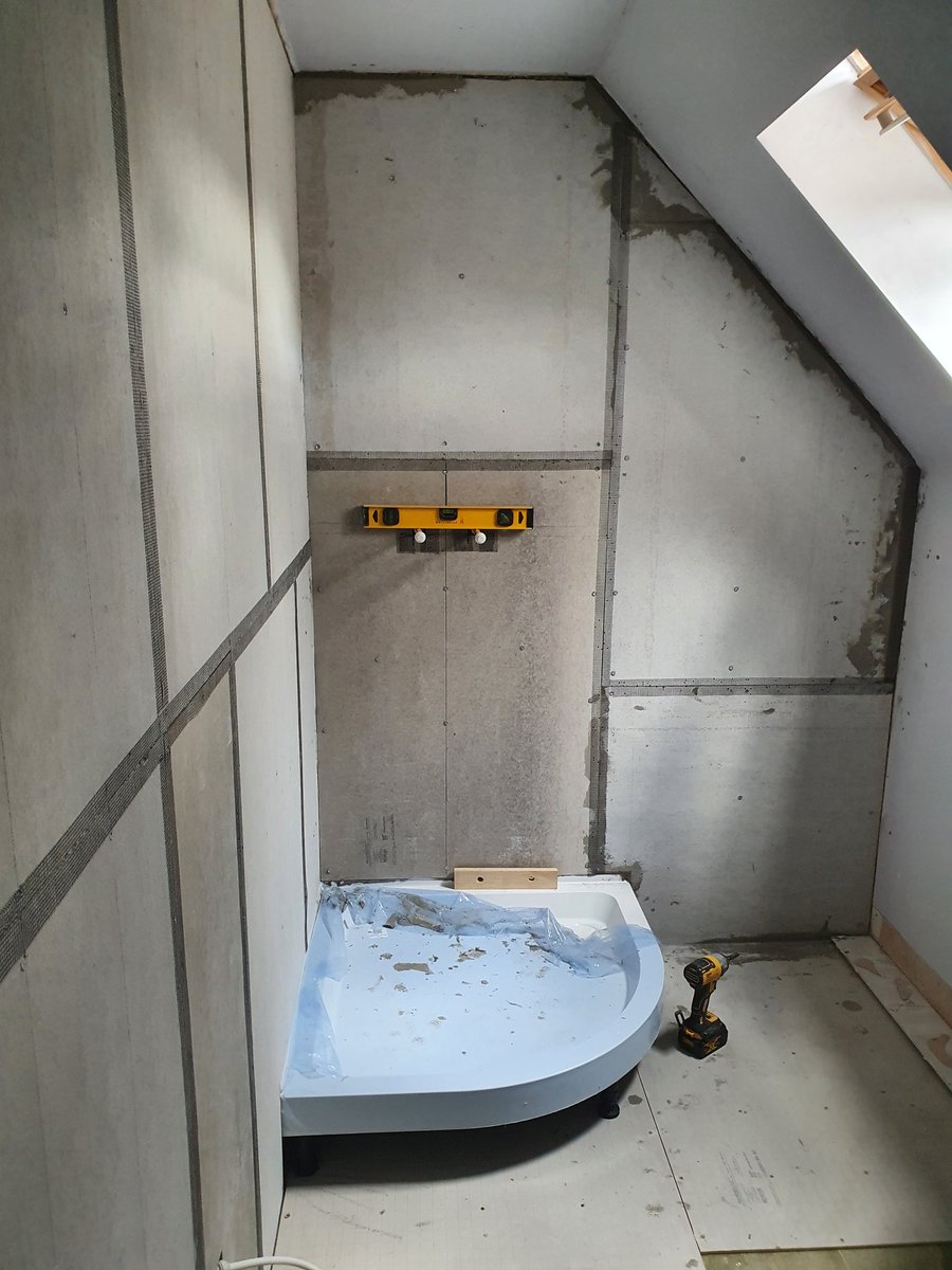 Chased new pipe work into the wall, concrete boarded , and new shower tray fitted