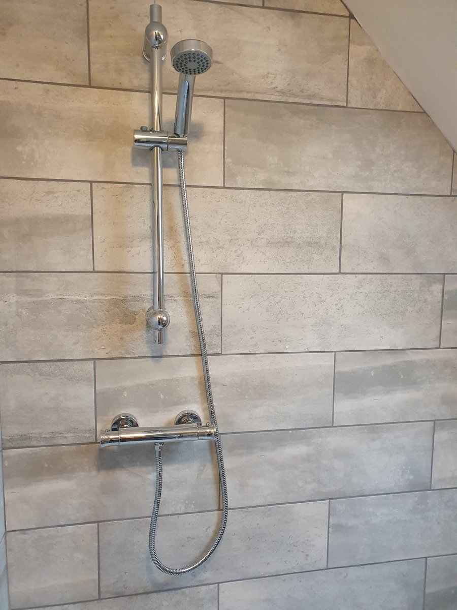 Floor to ceiling tiles, new shower bar