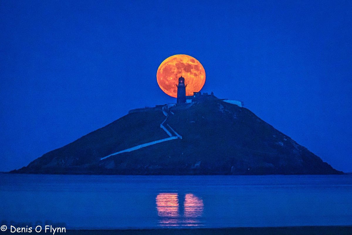 My view of the New Blood Moon as it rose behind Ballycotton Lighthouse as seen from Ballinamona Beach. Mother Nature at her finest.