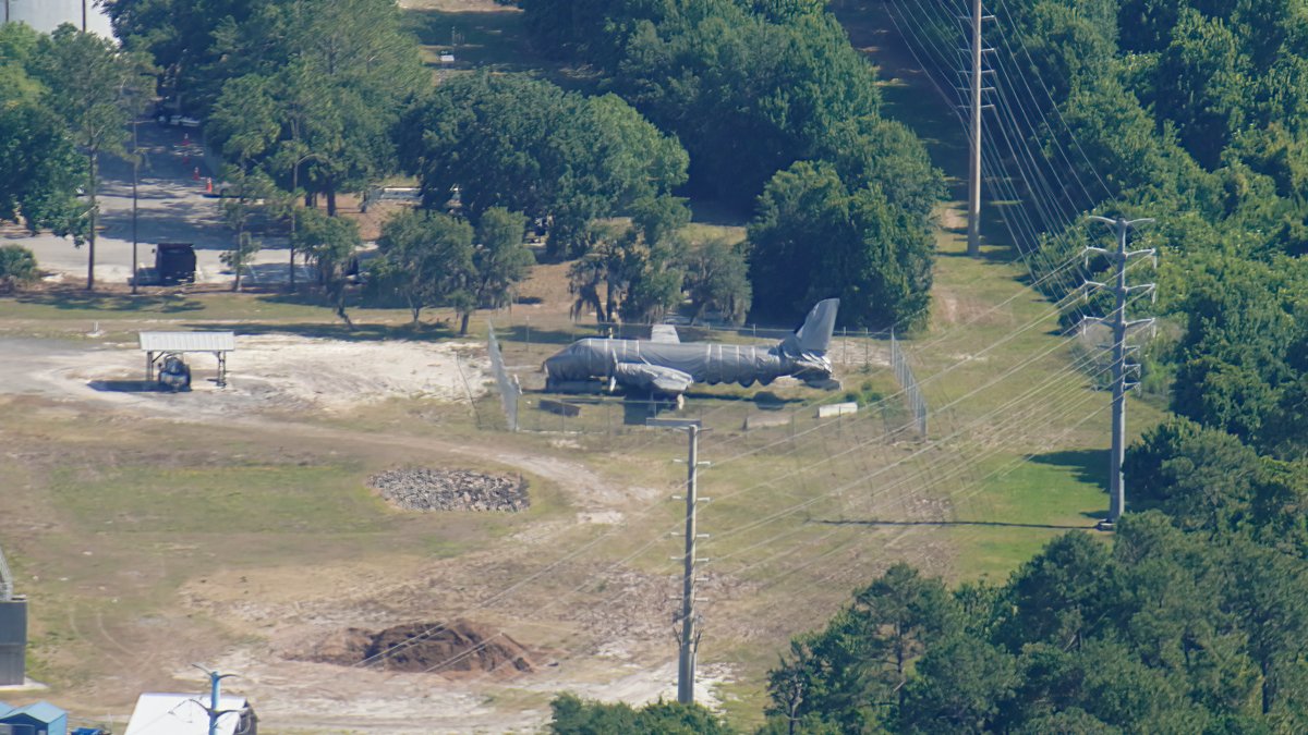bioreconstruct's tweet photo. Aerial look at Walt Disney's plane. In storage in a WDW service area north of Animal Kingdom. Wrapped in plastic. This is the plane that Walt flew in to survey the property. Plane was on display for many years in Disney's Hollywood Studios. https://t.co/EZwN7g424F
