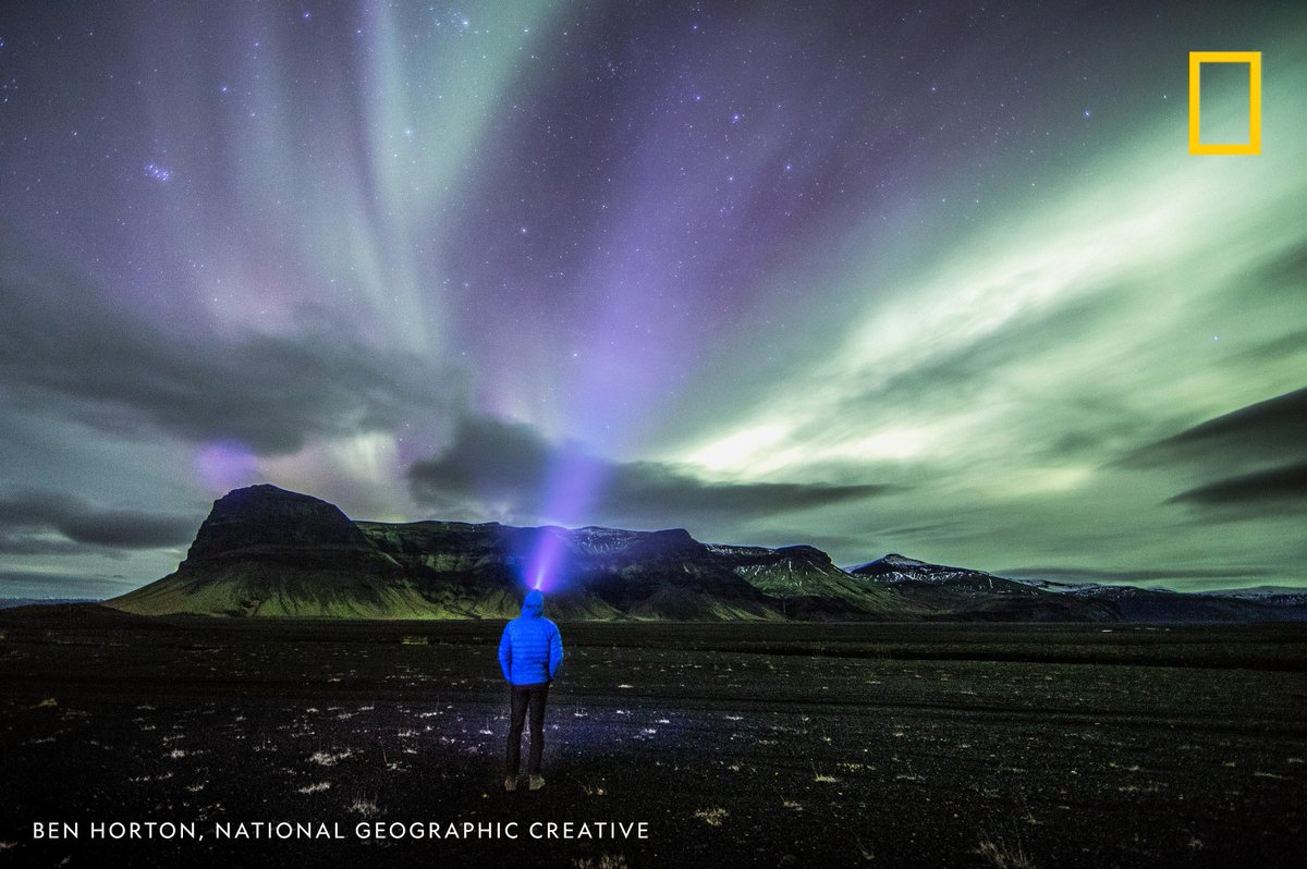 NatGeo's tweet image. A man walks toward a distant mountain rage in a remote region of Iceland in this inspiring view captured by photographer Ben Horton