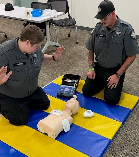 ClarkeCoSheriff's tweet photo. Welcome new CCSO team members Deputy William Palmer and Detention Officer Susie Gordon, here participating in our New Deputy Orientation. All uniformed members are required to complete First Aid / CPR / AED training. https://t.co/05DdRThaDA