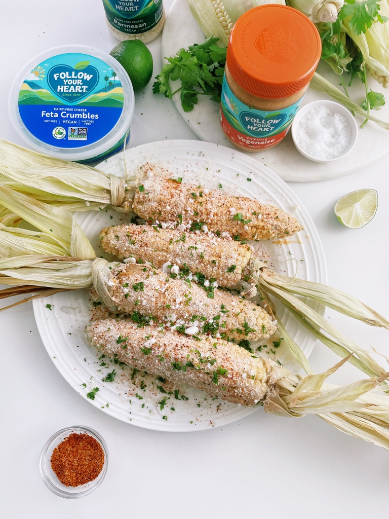 FollowYourHeart's tweet photo. Can you tell we're all ears lately? The start of summer has us craving corn! Julie's Kitchen tackles a classic Elote for her #MeatlessMay challenge. Loaded with #Vegenaise, #DairyFree Feta Crumbles, and Grated Parmesan, you'll make one over &amp; over. Recipe: https://t.co/9SscZK2tcK https://t.co/OSgrWW26bb