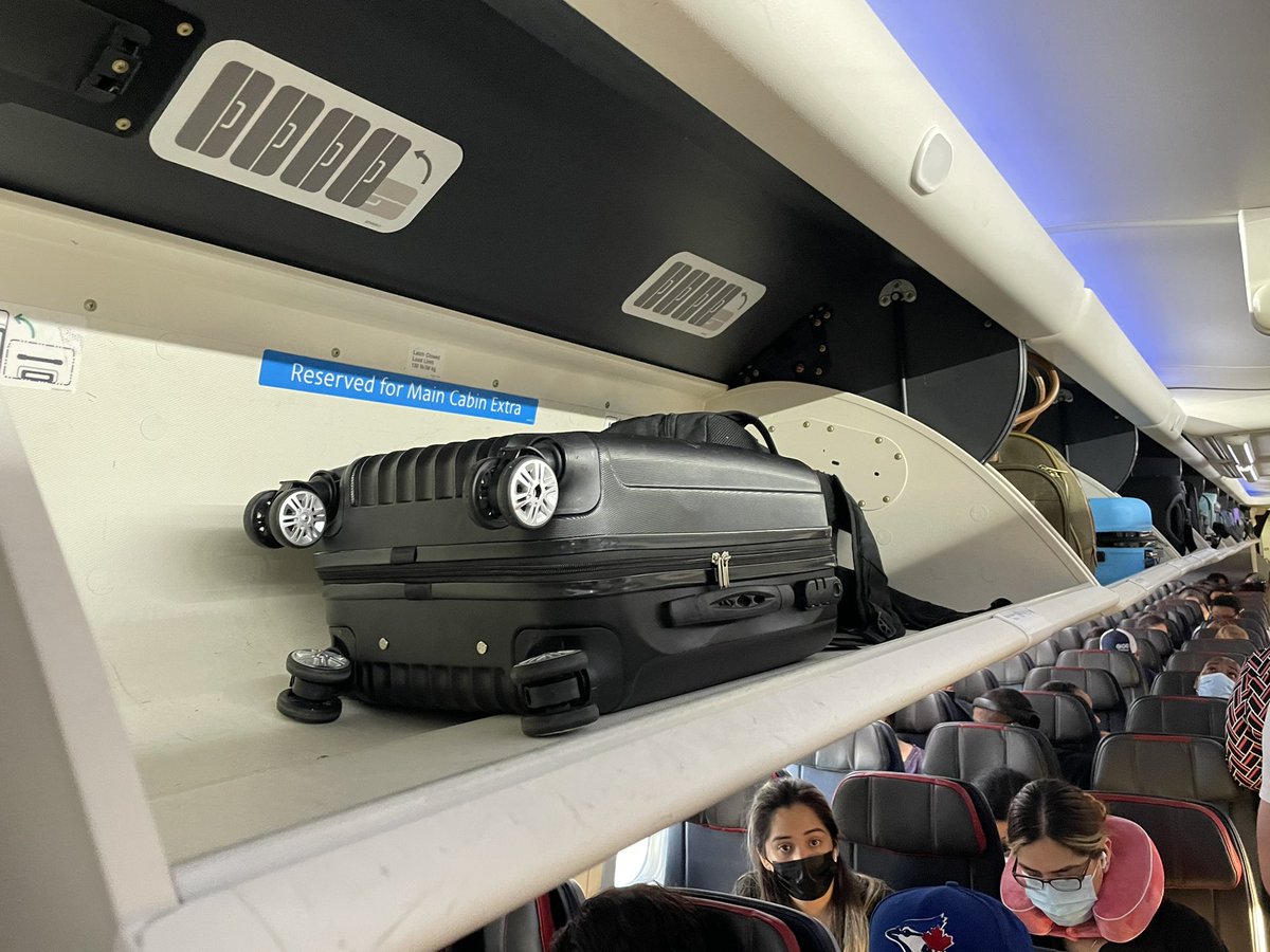 ralcMD's tweet photo. What do you know. @AmericanAir forcing me to check my bag again despite plenty of overhead bin space. Now my midnight arrival is 12:30am+. Thanks American. https://t.co/3W9B16vbzO