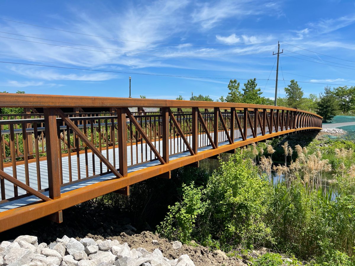 drewdilkens's tweet photo. The new 30-metre McHugh Bridge has been completed! This new iron bridge helps connect two popular trails: Little River Corridor &amp; Ganatchio Trail. Find it located right across Little River near the WFCU Centre and McHugh Street. #BuildBackBetter #ExploreYQG https://t.co/lKKk01IlsK
