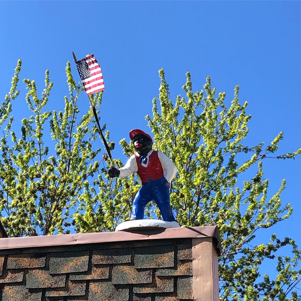 TanekaHyeWol's tweet photo. Disappointed and angry to see this offensive, #racist #blackface statue on top of a house in #twoharborsmn earlier today. @mayorswanson https://t.co/q29AjvoxCn
