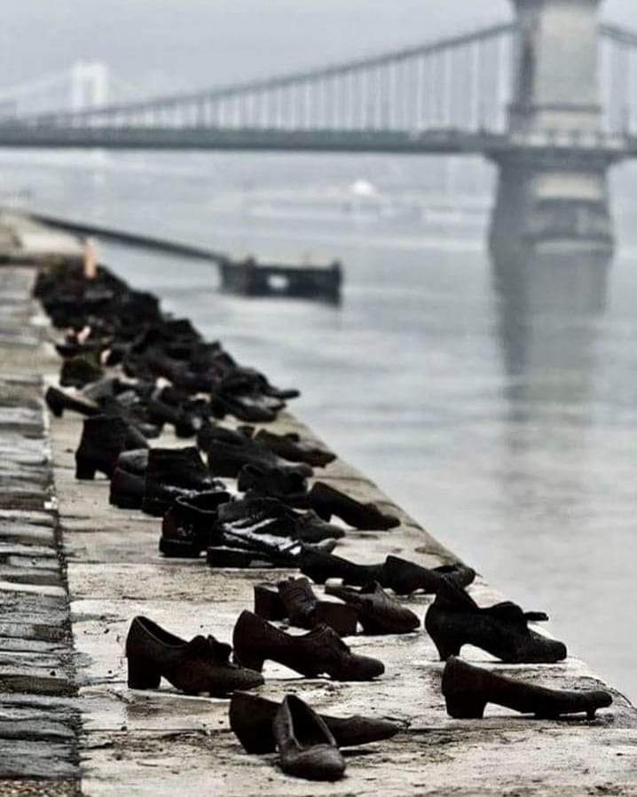 During WWII, Jews in Budapest were brought to the edge of the Danube, ordered to remove their shoes, and shot, falling into the water below.

60 pairs of iron shoes now line the river's bank, a ghostly memorial to the victims.