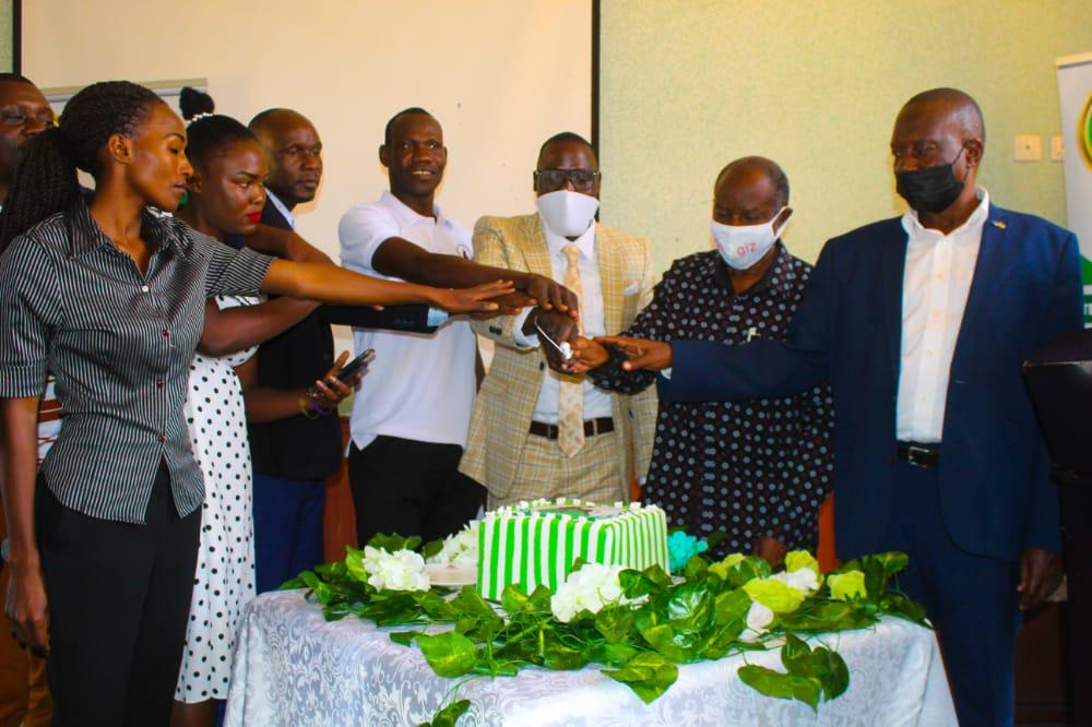TesoProfession1's tweet photo. The Guest of Honor Papa Ekirigi, Hon Ekapu Leonard together with the team of Teso Professionals Secretariat Cutting a cake during the official opening of the Teso Professionals Office. https://t.co/QleiPNHRLy
