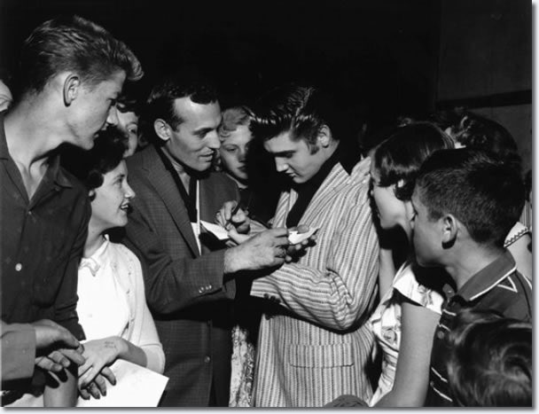 MartyJay2's tweet photo. One of my favourite early classic #ElvisHistory pics from 1st June in #Elvis1956 as #CarlPerkins & @ElvisPresley exchange autographs #OvertonParkShell #Memphis https://t.co/wBrcqcdp7U