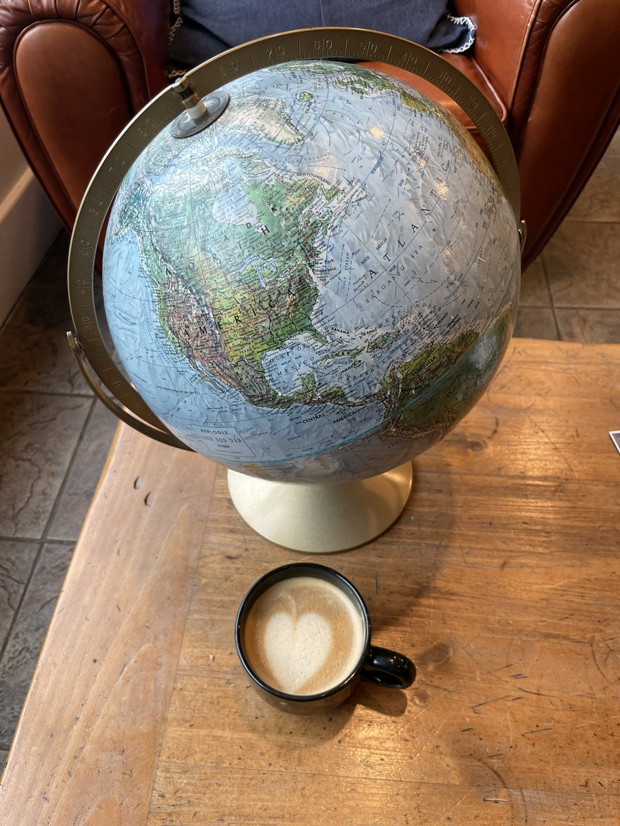 Sitting in my favorite coffee shop, found a place to sit down and chill, put my drink down in front of this globe on the table. And was reminded we need to Love each other and our Planet. #WeAreONE