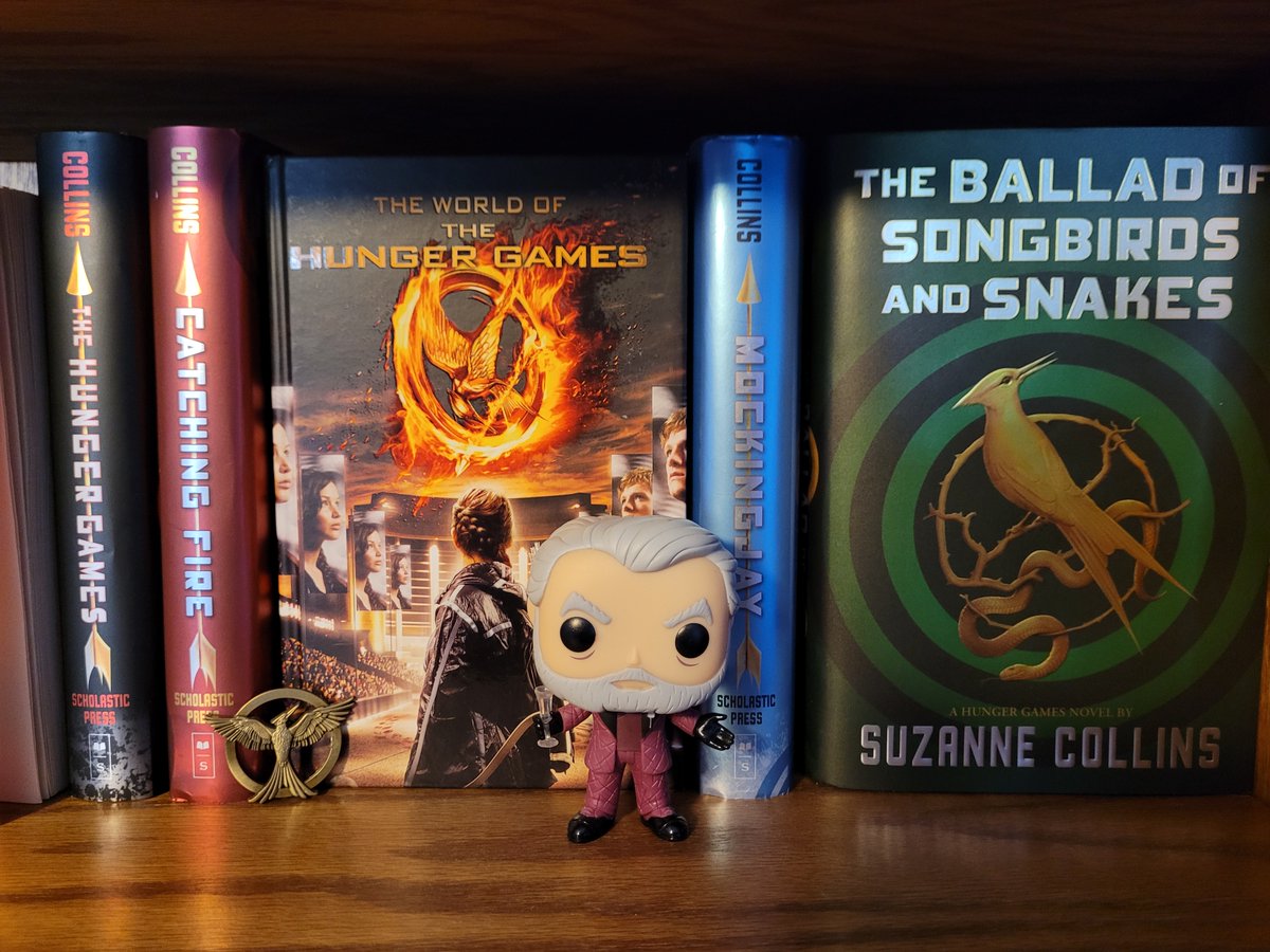 TheseDamnJams's tweet photo. #ThrowbackThursday to when Emma's bookshelf game was ON POINT. All she needs is some *mahogany.* She had a lot to say about President Snow in our podcast episode: https://t.co/E8Jyq1b0Ss 

 @SuzanneCollins1 @ElizabethBanks @funko @TheHungerGames #PodcastandChill https://t.co/xfAajdNwFZ