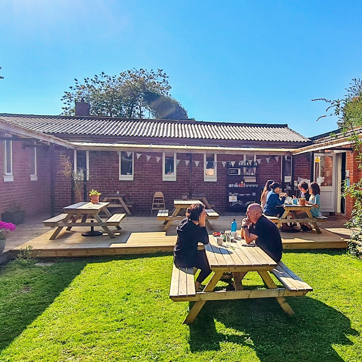 WoolerYHA's tweet photo. Lovely to see some of our guests sitting enjoying their breakfasts in our sunny courtyard area this morning. Long may the sunshine continue! 🌞 #YHA #BankHolidayWeekend #indiehostel @YHAOfficial @indiehostelsuk #godscountry https://t.co/IO347RKySe