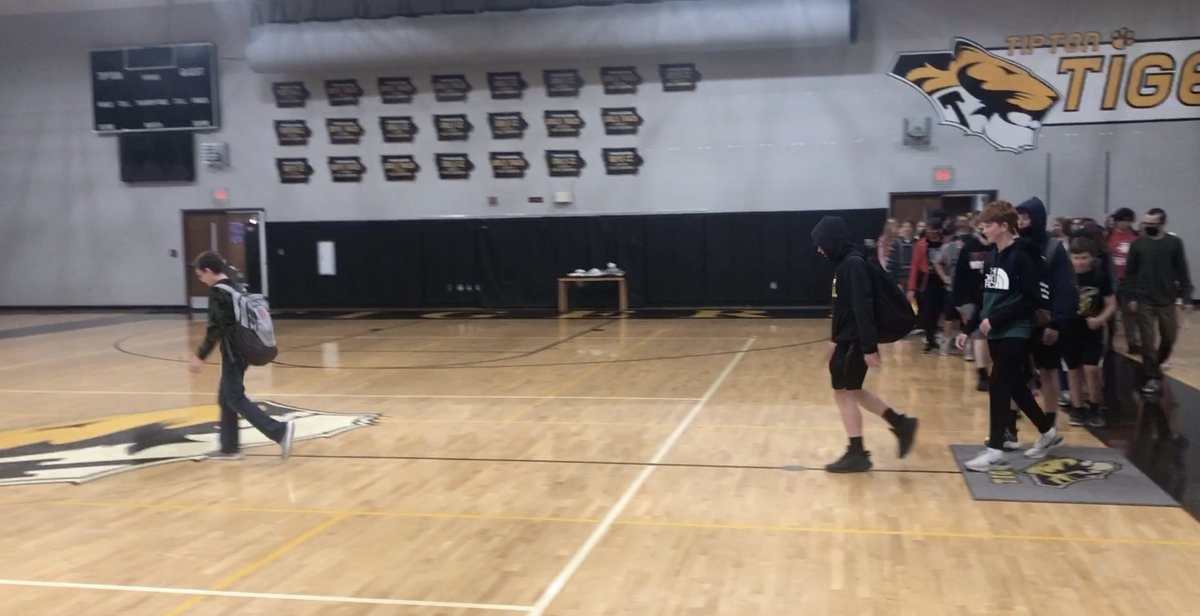 TiptonTigersMS's tweet photo. On their 1st day of MS (top few rows) they got a Tiger tunnel. Thursday they made their final walk in our halls & across the Tiger logo for the last time. They've been a great class and will do awesome at THS. Congrats!!! #TMSTigerPride π― https://t.co/giEHaMDjct