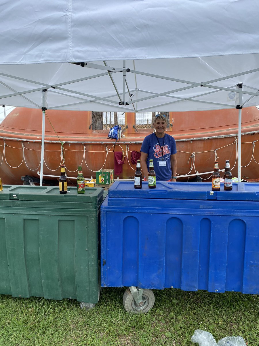 exmarlinhunter's tweet photo. Rockport Tx. Wine Fest benefiting Maritime Museum. Mary before gate  opened volunteering to sell beer, what’s that shirt she’s wearing? Oops @BitterSisters https://t.co/MYVYCjYAkO
