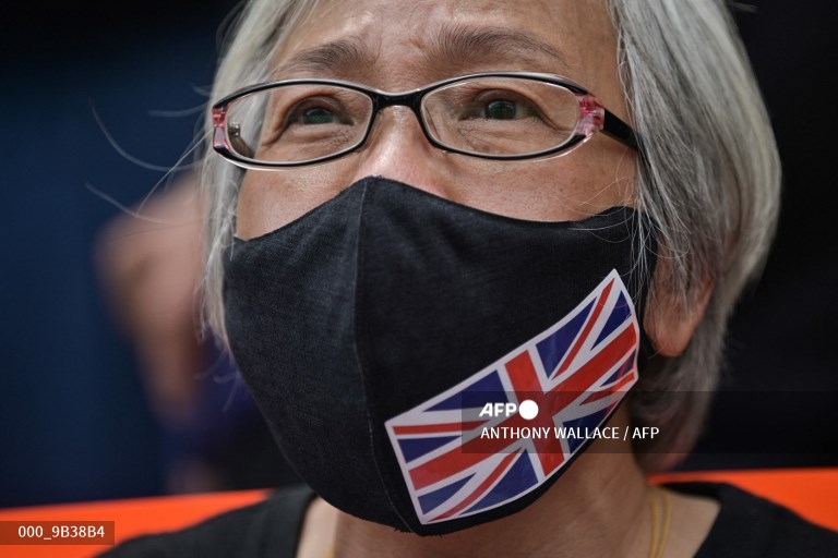 AFPphoto's tweet image. Hong Kong's 'Grandma Wong' arrested for solo Tiananmen protest #AFP 
📸 @AntAFP
📷 Isaac Lawrence