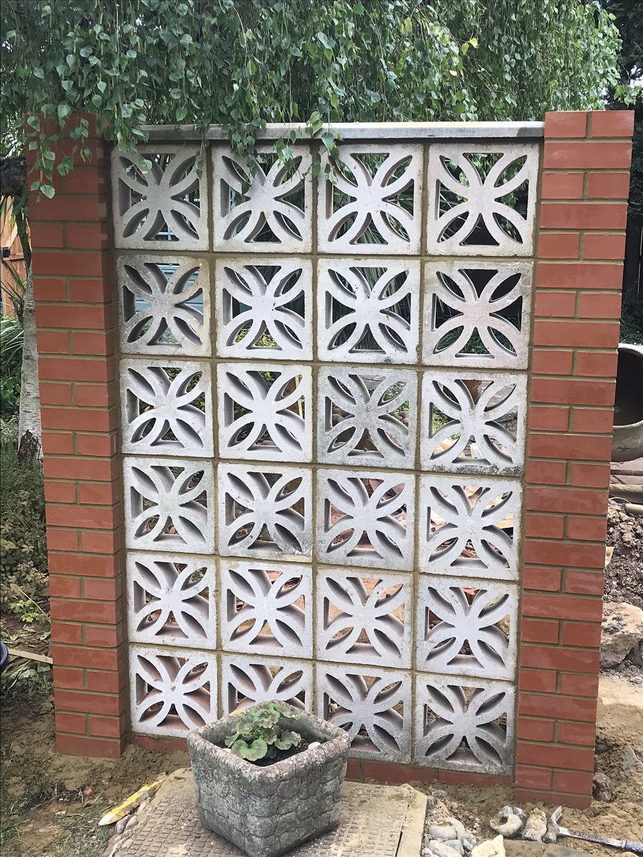 Screen wall rebuilt with reinforced engineering brick piers at either end.