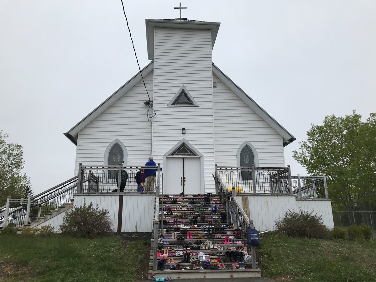 215 pairs of shoes are being placed on the steps of the church in Membertou today.  To honour the 215 children whose remains were found near a former residential school in Kamloops.  ⁦<a href="/CTVAtlantic/">CTV News Atlantic</a>⁩