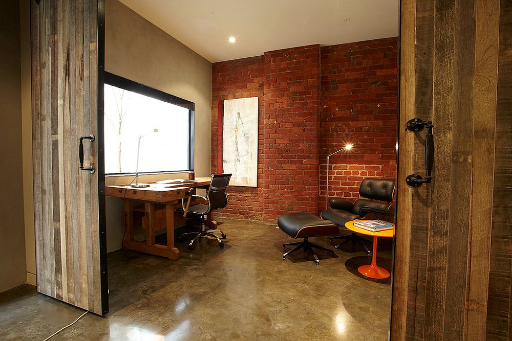 GreenerInspects's tweet photo. That is a great idea using the barn doors as a decorative way to create some privacy for this home office. Also loving the huge natural light window and exposed brick wall. #workfromhome #comfortspace #greenerinspections https://t.co/VhZKNjw88P