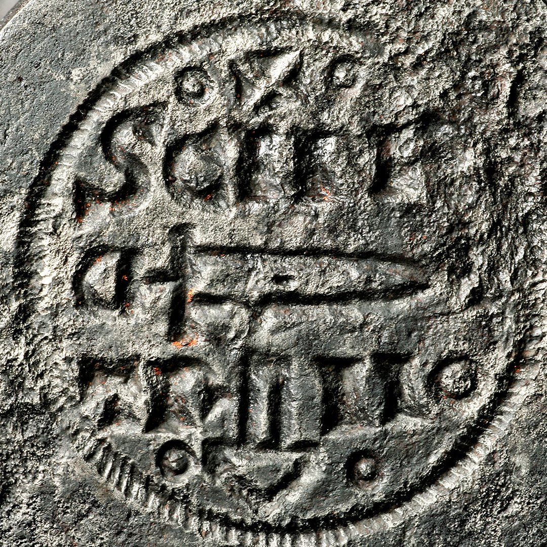 At the Coppergate dig, two Viking-age coin dies were found.
Using a hammer, the dies were used to imprint a design on a metal coin. One of the designs references Saint Peter, the patron saint of York Minster. It also shows a sword and hammer, thought to be the hammer of Thor.