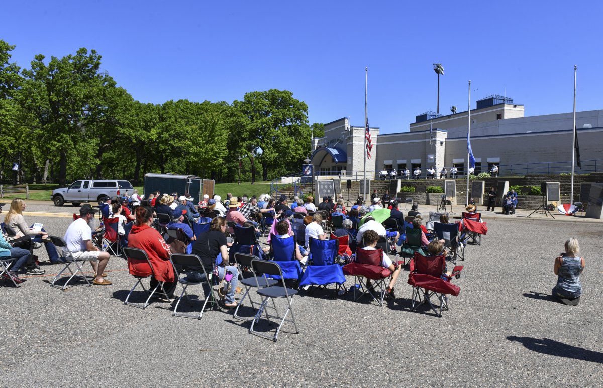 People gather for a Memorial Day ceremony Monday at Veterans Plaza in St. Cloud. Photo gallery is here: bit.ly/34zYkVC <a href="/sctimes/">St. Cloud Times</a>